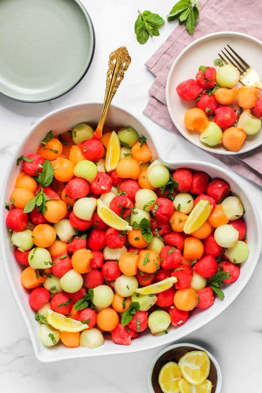 melon balls salad in a large heart shaped platter
