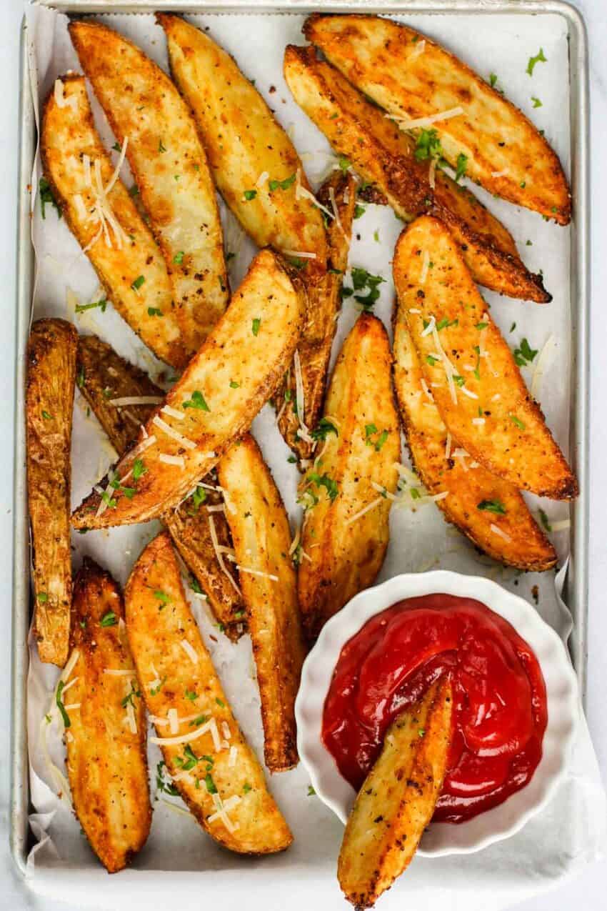 potato wedges served with ketchup