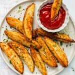 potato wedges served with ketchup