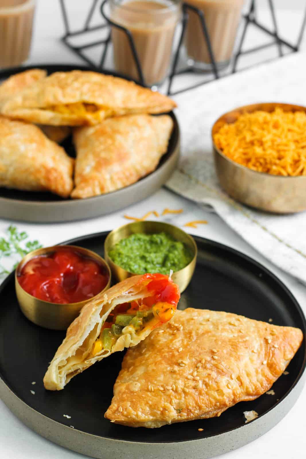 Jalapeno Cheese samosas served with chutney, ketchup and chai 
