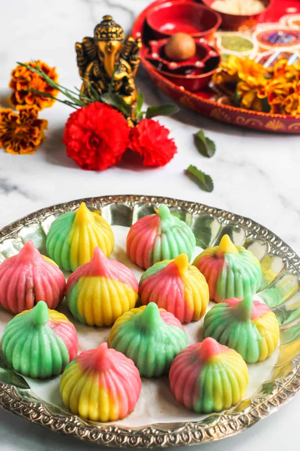 tri color ukadiche modak in a silver plate 