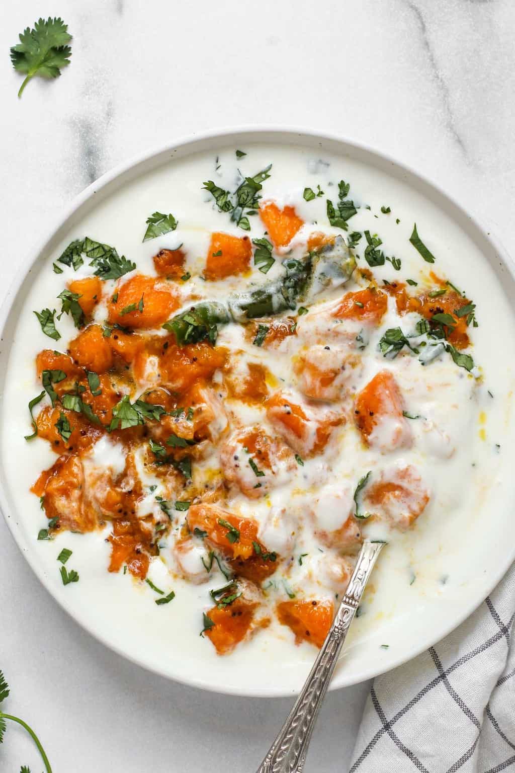 pumpkin raita in a white bowl 