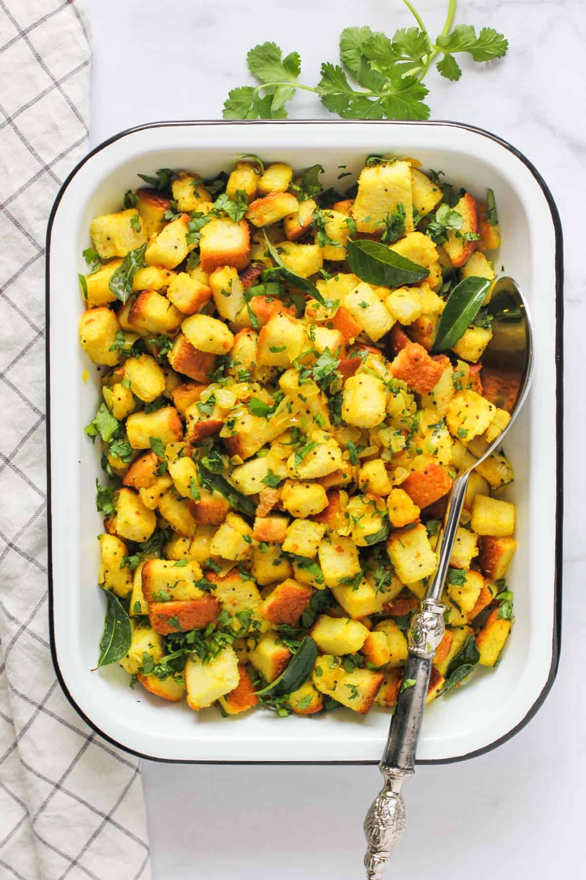 Bread upma in a white serving dish