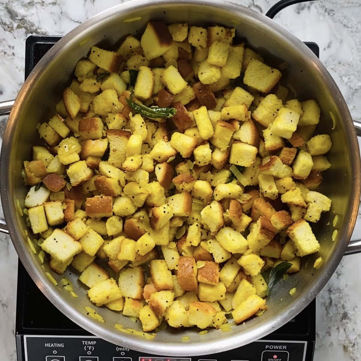cooked bread upma in a pan.
