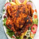 whole tandoori chicken in a serving platter