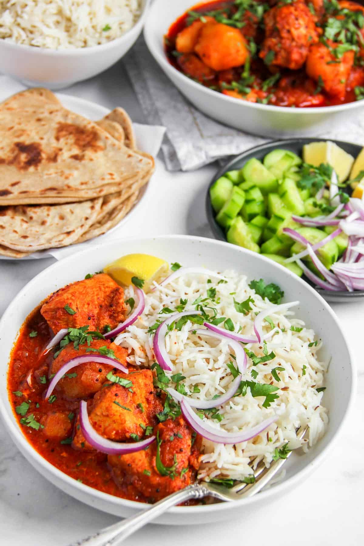chicken curry with potatoes served with basmati rice 