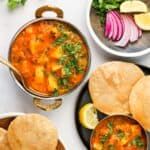 aloo rasedar served with puri