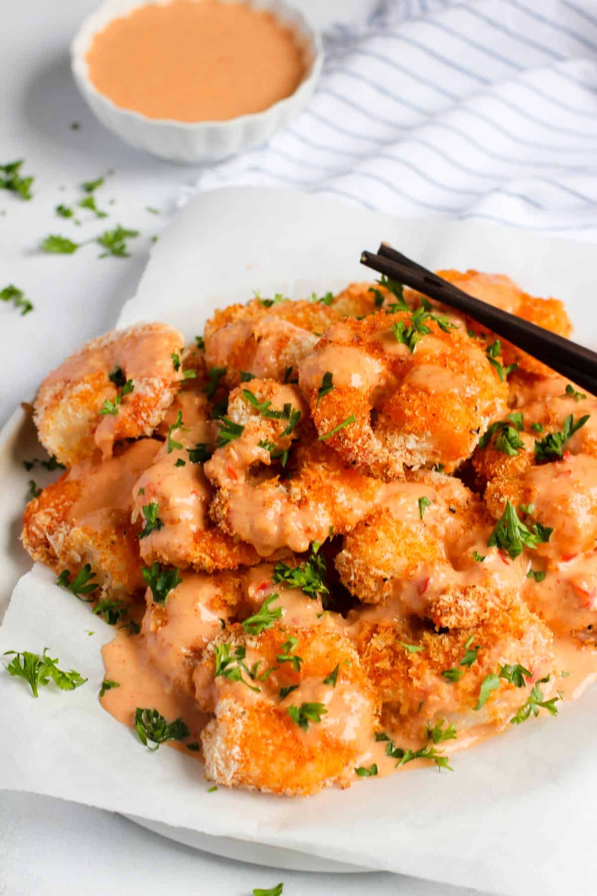 air fryer bang bang shrimp drizzled with spicy sauce