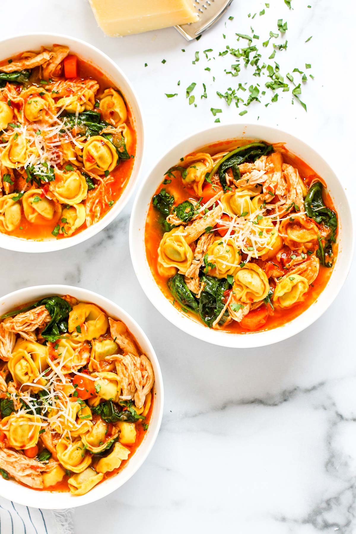 three bowls of chicken tortellini soup