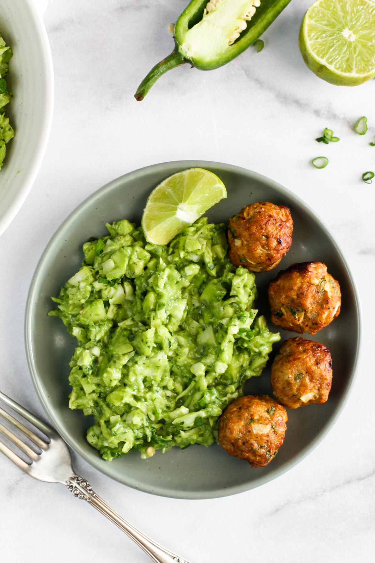 green goddess salad served with  chicken meatballs 