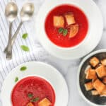 tomato beet soup served with croutons