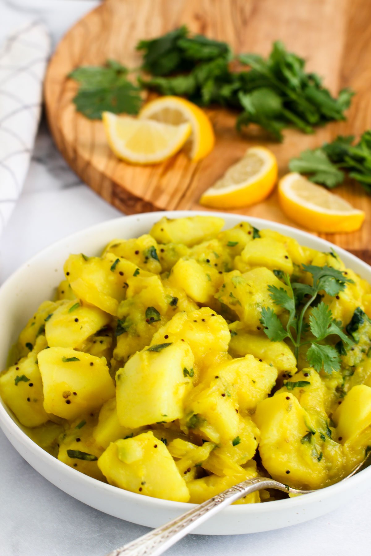 Batata Bhaji served in a white bowl 