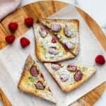yogurt toast topped with raspberries and powdered sugar