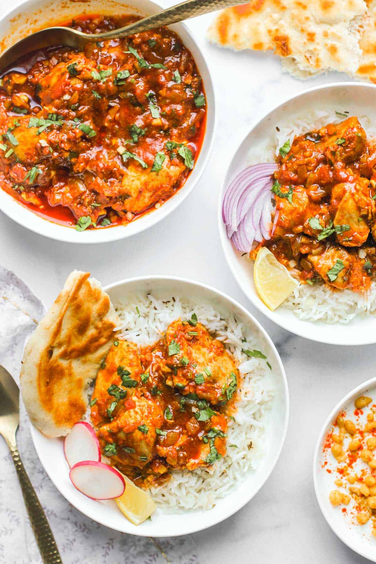 chicken karahi served with rice and naan