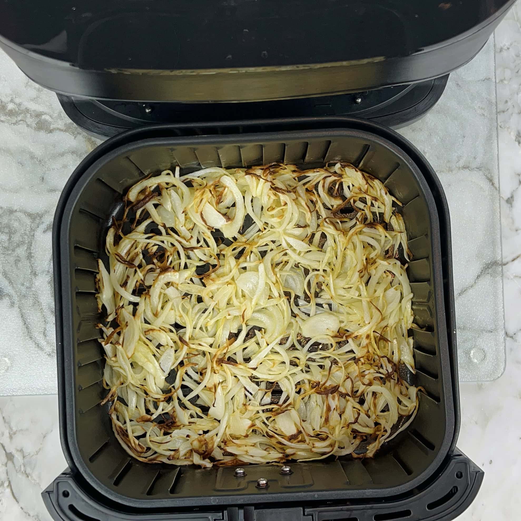 sliced onions after cooking for 15 mins in the air fryer 
