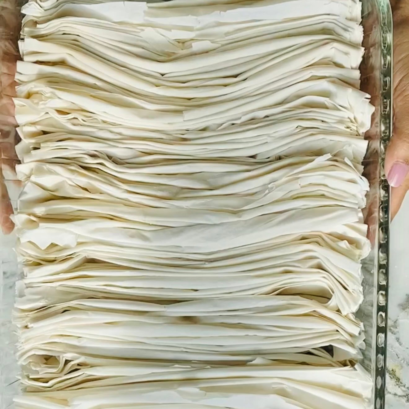 baking dish with folded phyllo dough