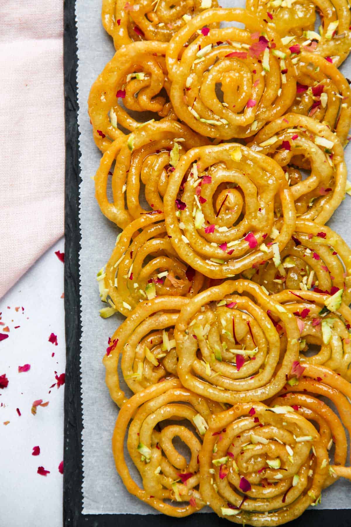 Jalebis served on a parchment lined platter