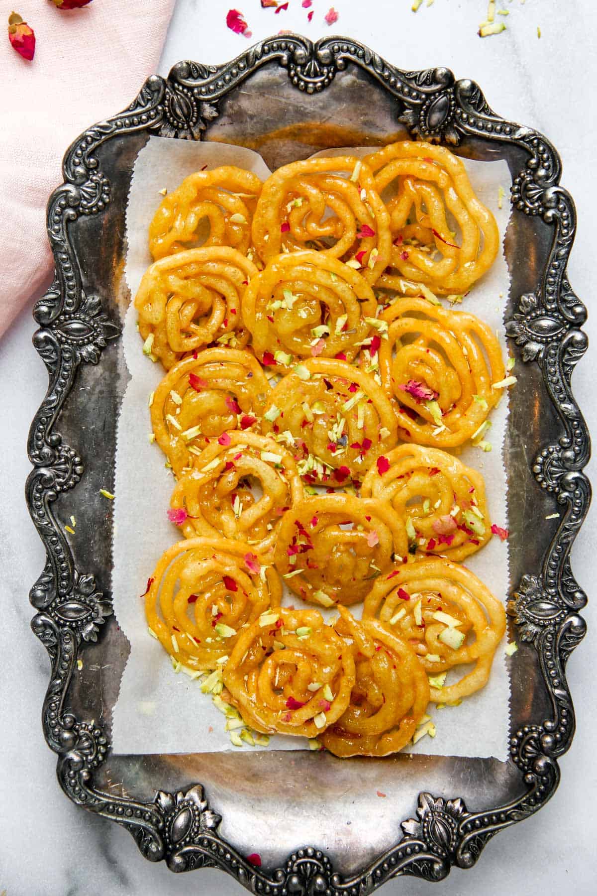 Jalebis served on a silver platter 