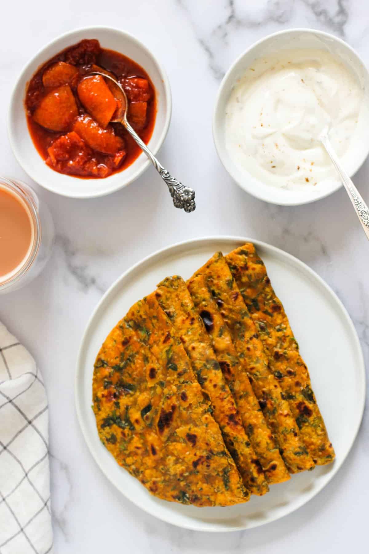Methi Thepla served with pickle  and yogurt 