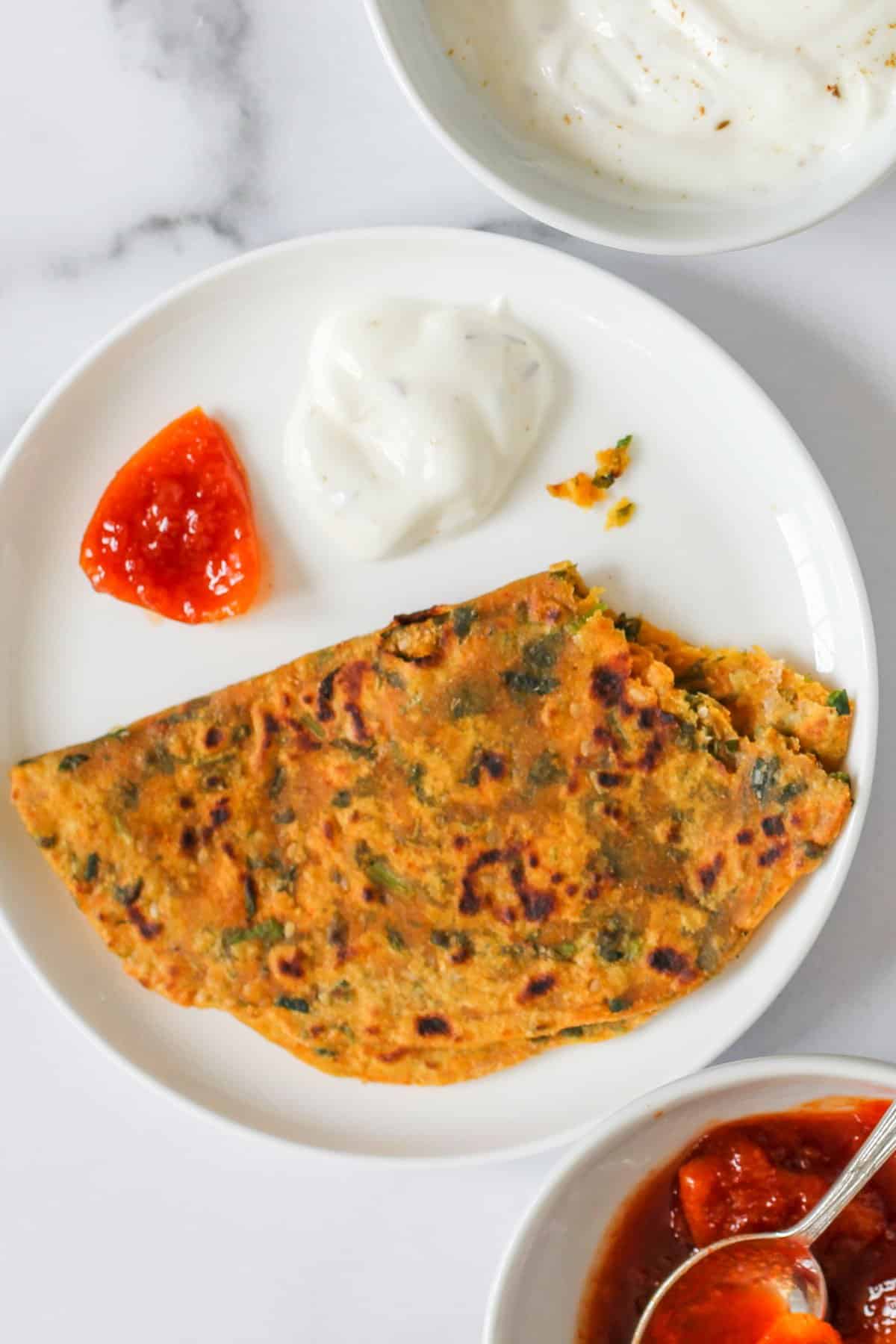 Methi Theplas served with yogurt and lemon pickle 