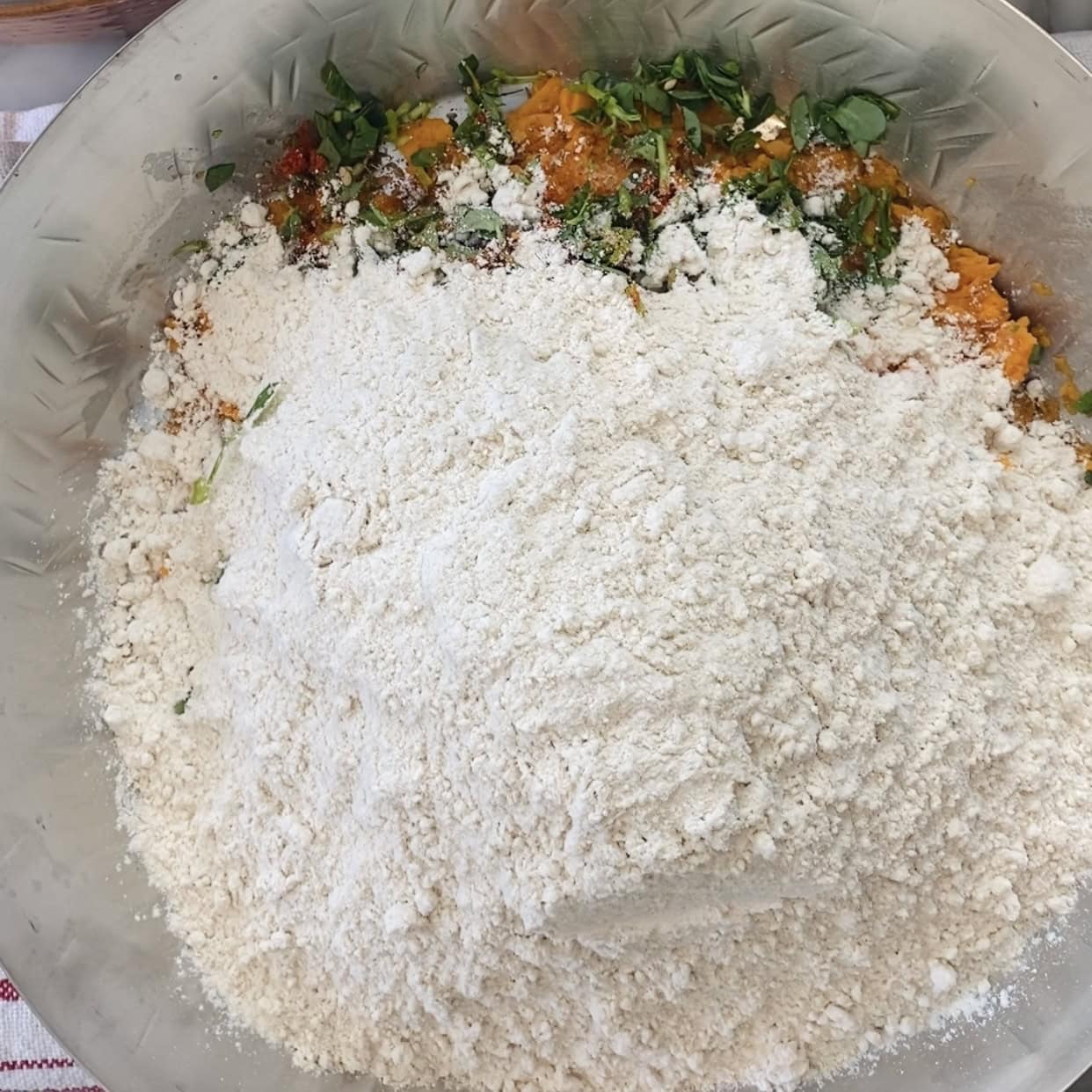 Thepla dough ingredients in a mixing bowl.
