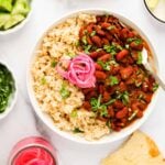 Rajma curry served with brown rice and pickled onions