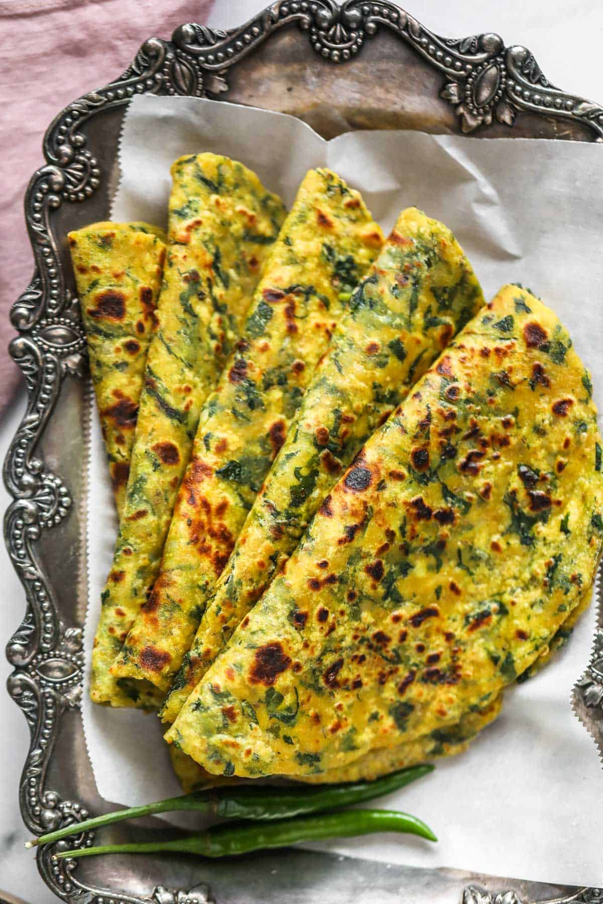 Kale parathas in a silver platter 