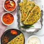 Kale parathas served with yogurt and chutney