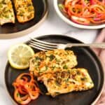 methi garlic salmon served in two black plates
