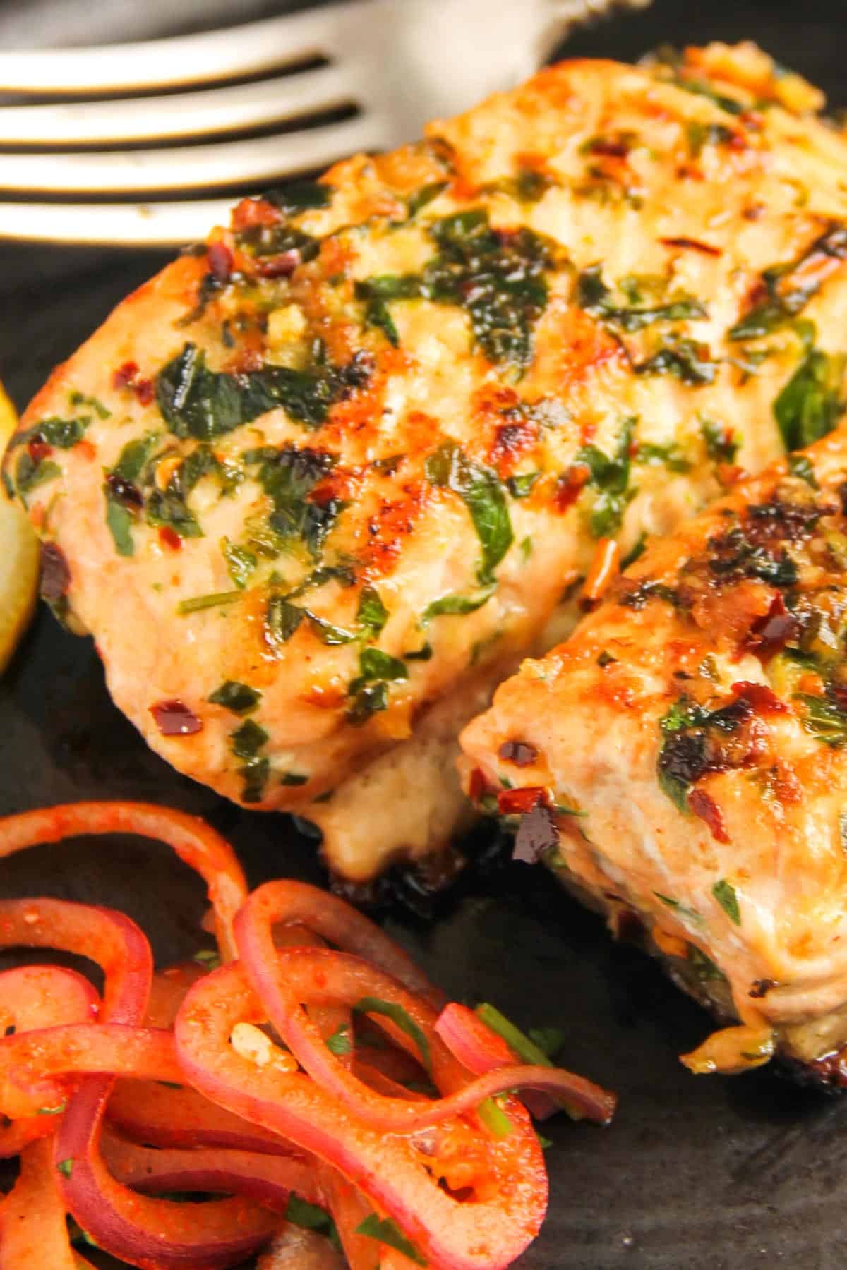 close up of roasted salmon with garlic and fenugreek