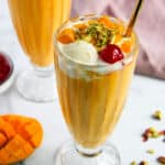 Mango MAstani garnished with diced mangoes, nuts and cherry