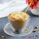 Pistachio latte garnished with sliced pistachios