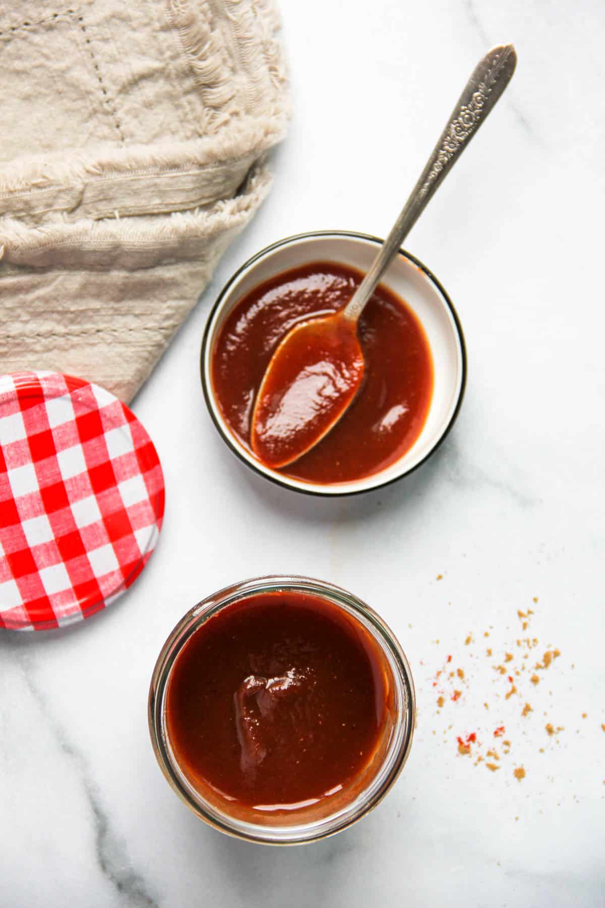 Tamarind chutney in a glass jar and small bowl