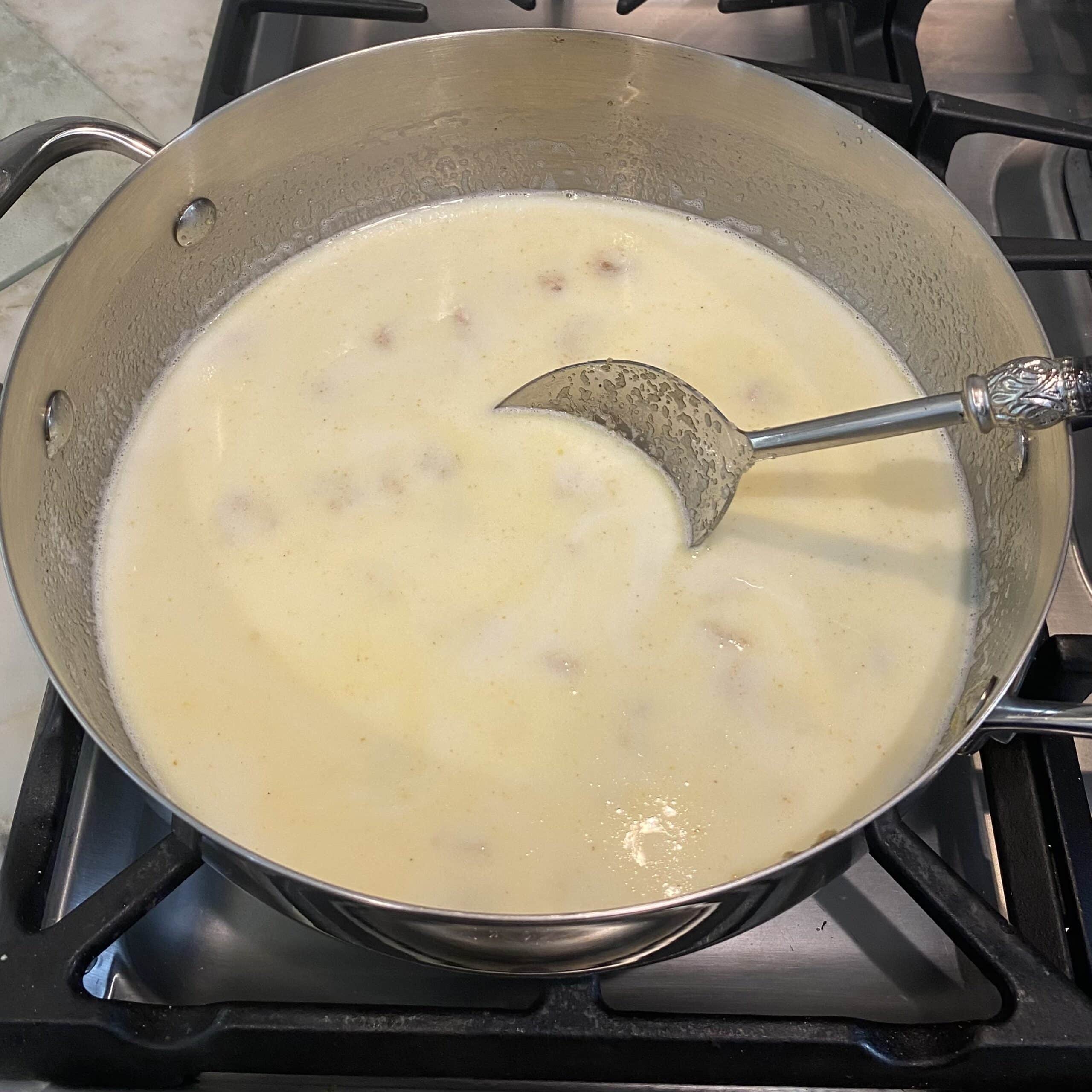 milk added to pan with sooji.