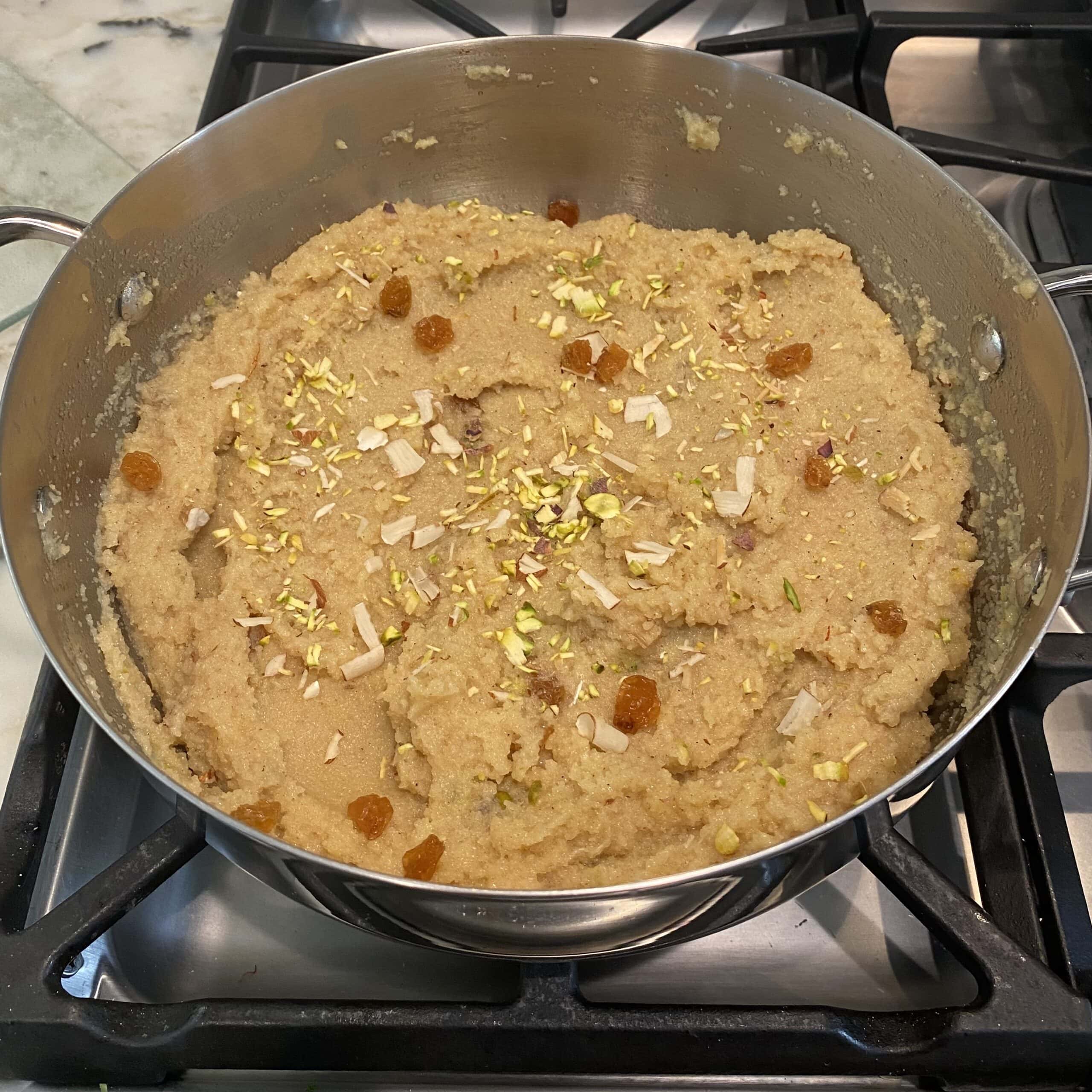 sheera garnished with nuts and raisins. 