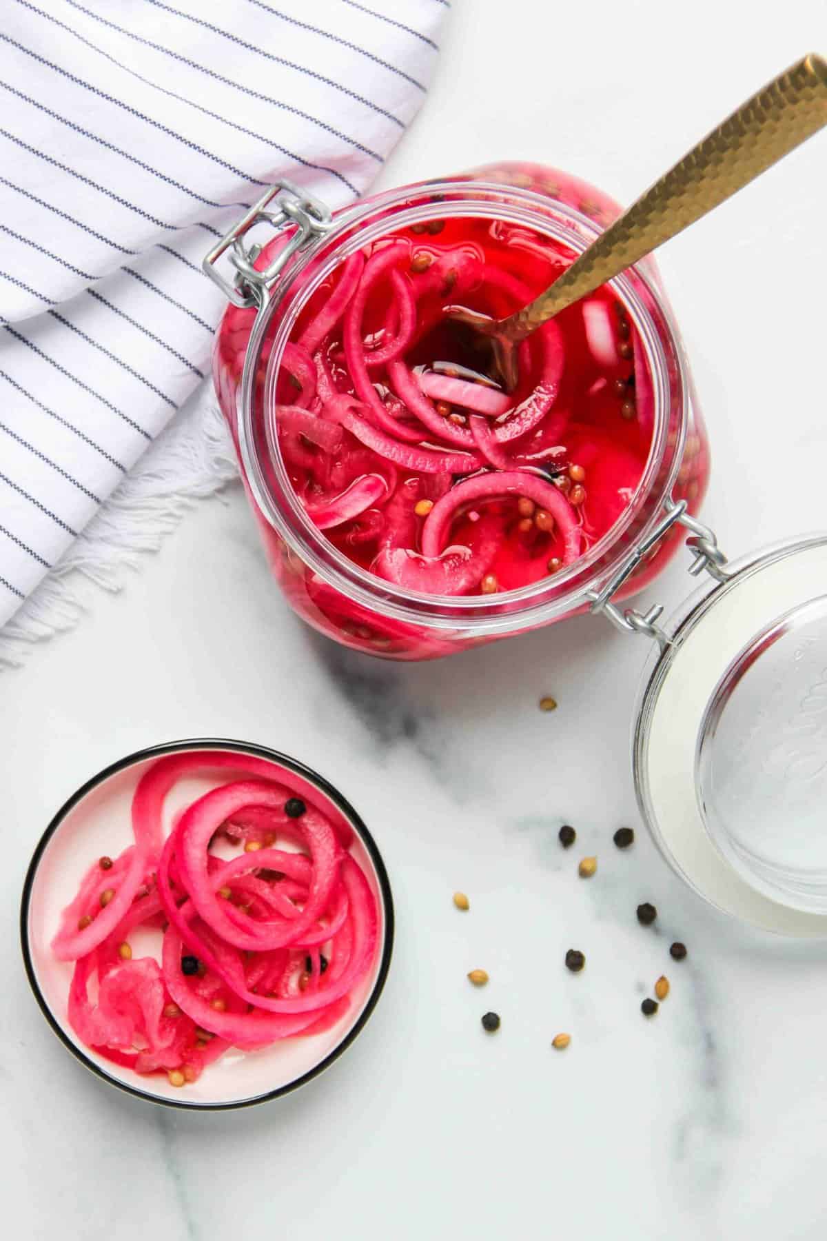 pickled onions in a jar and small bowl