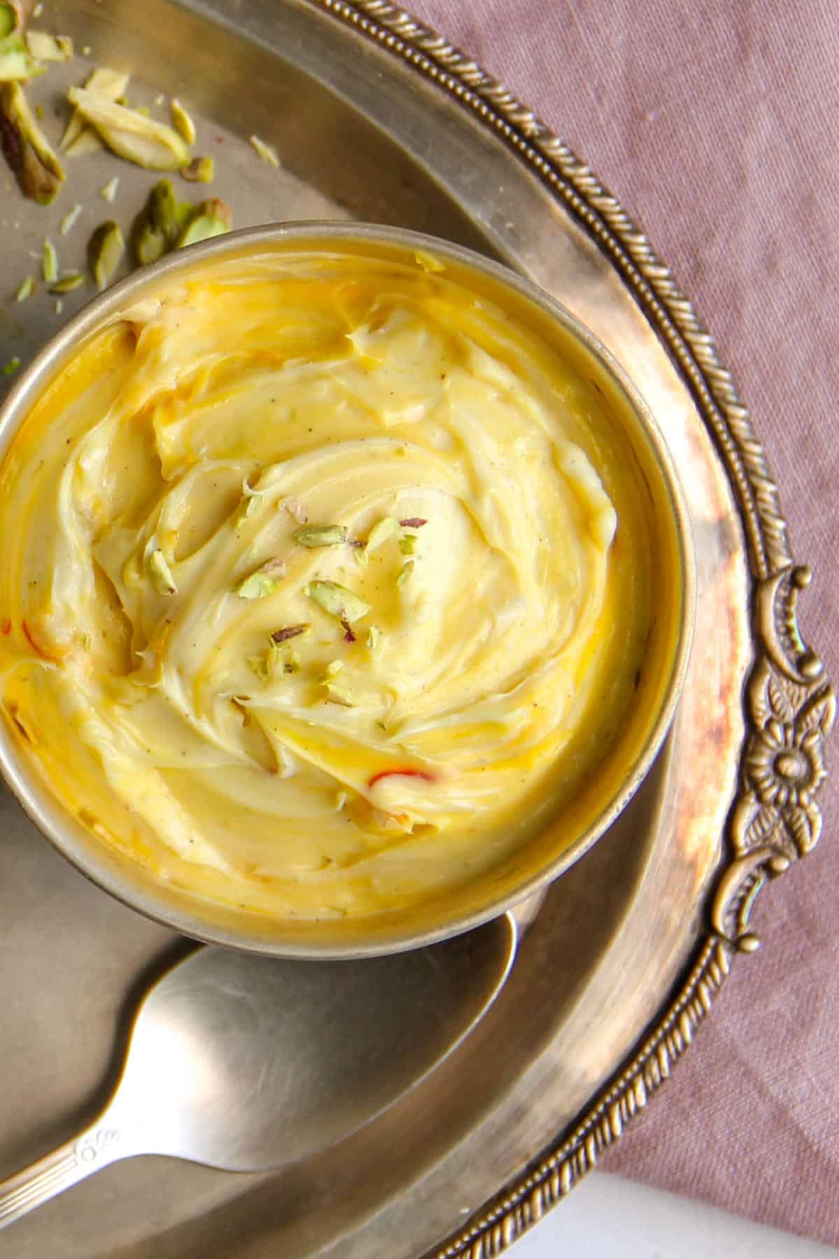 kesar elaichi shrikhand in a silver bowl