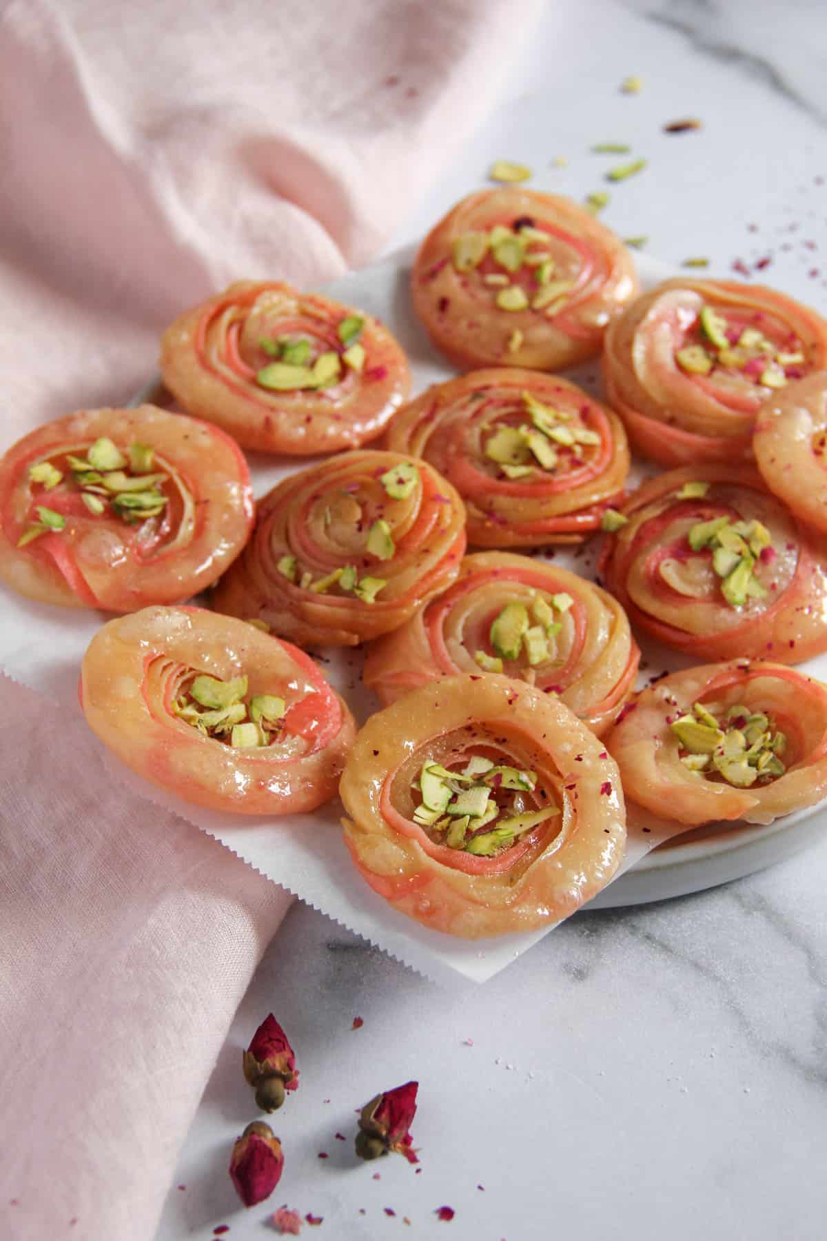 Chirote garnished with pistachios and rose petals 