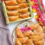 Rose Karanji in a plate and in a mithai box