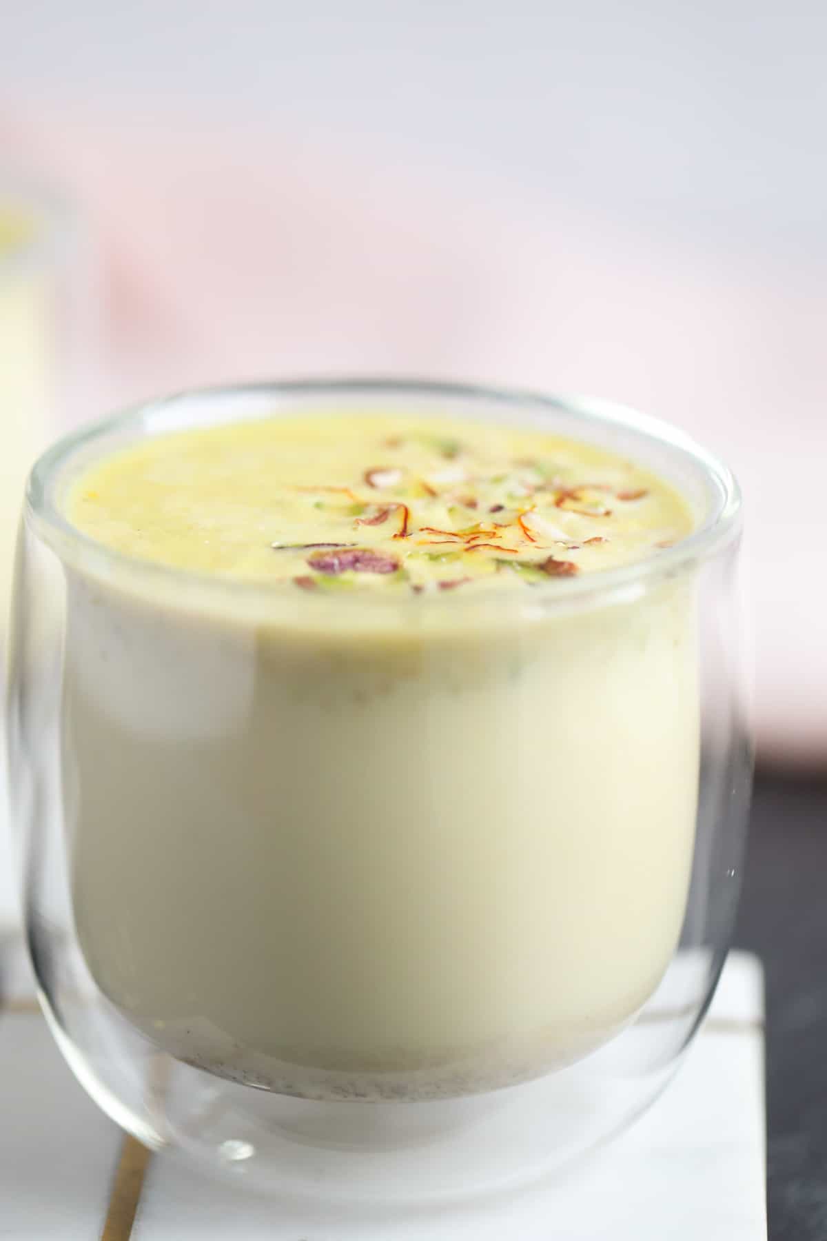 Sweet Masala milk in a glass cup