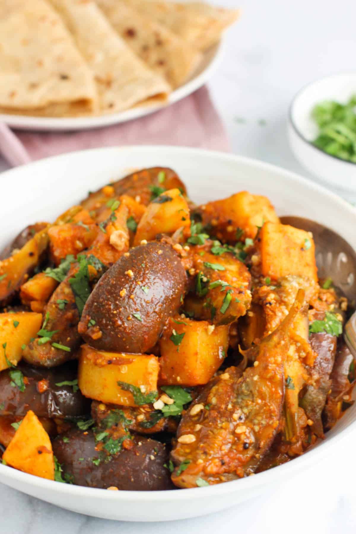 aloo baingan garnished with cilantro 