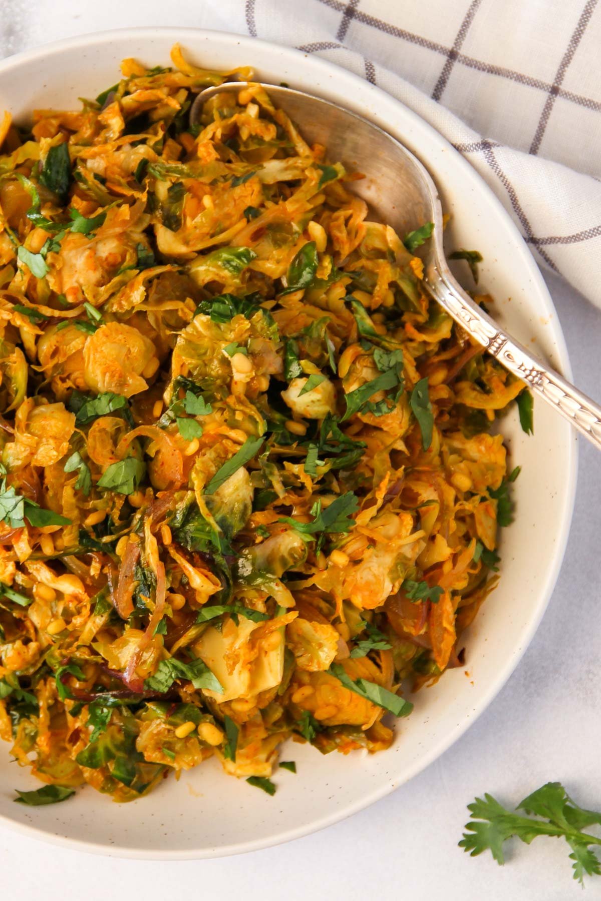 stir fried Indian Brussels sprouts curry in a white bowl 