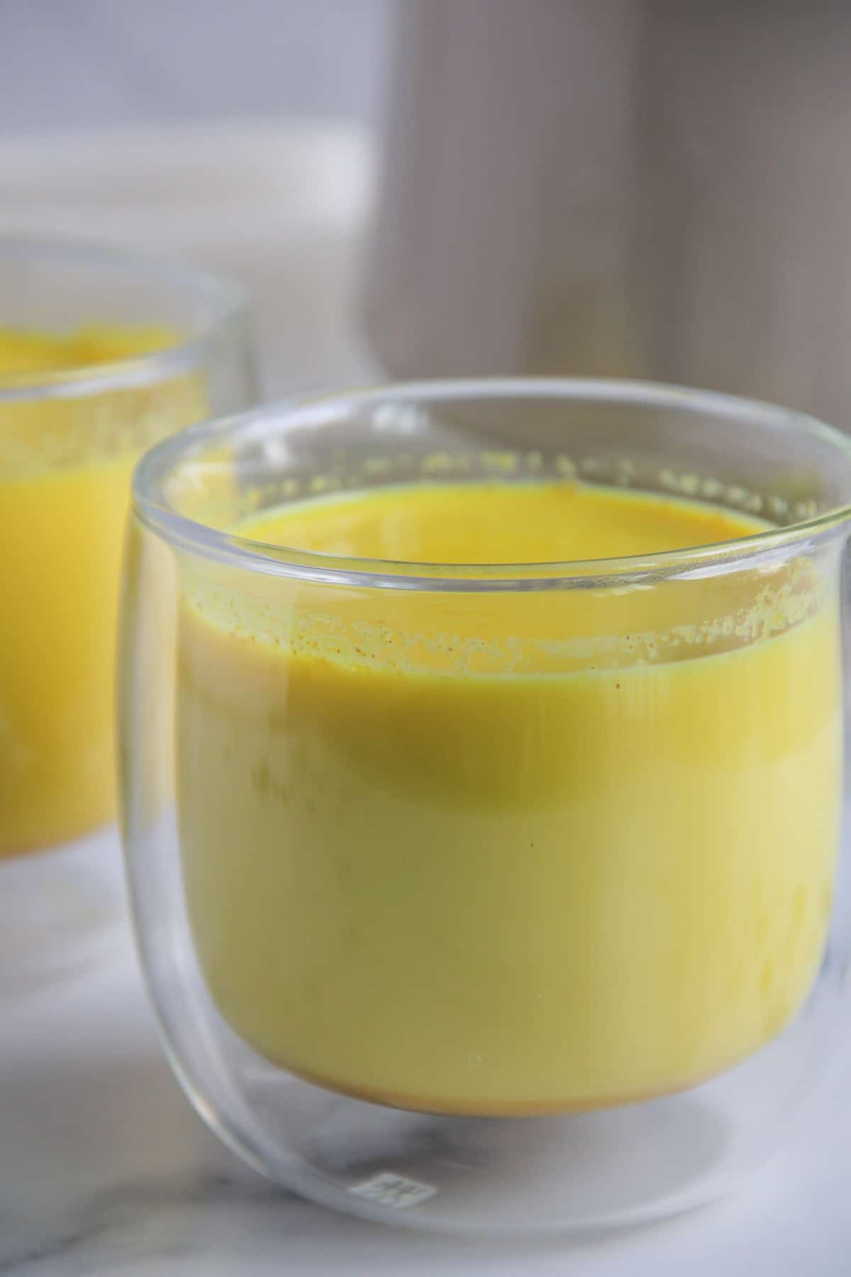 haldi doodh in a glass cup 