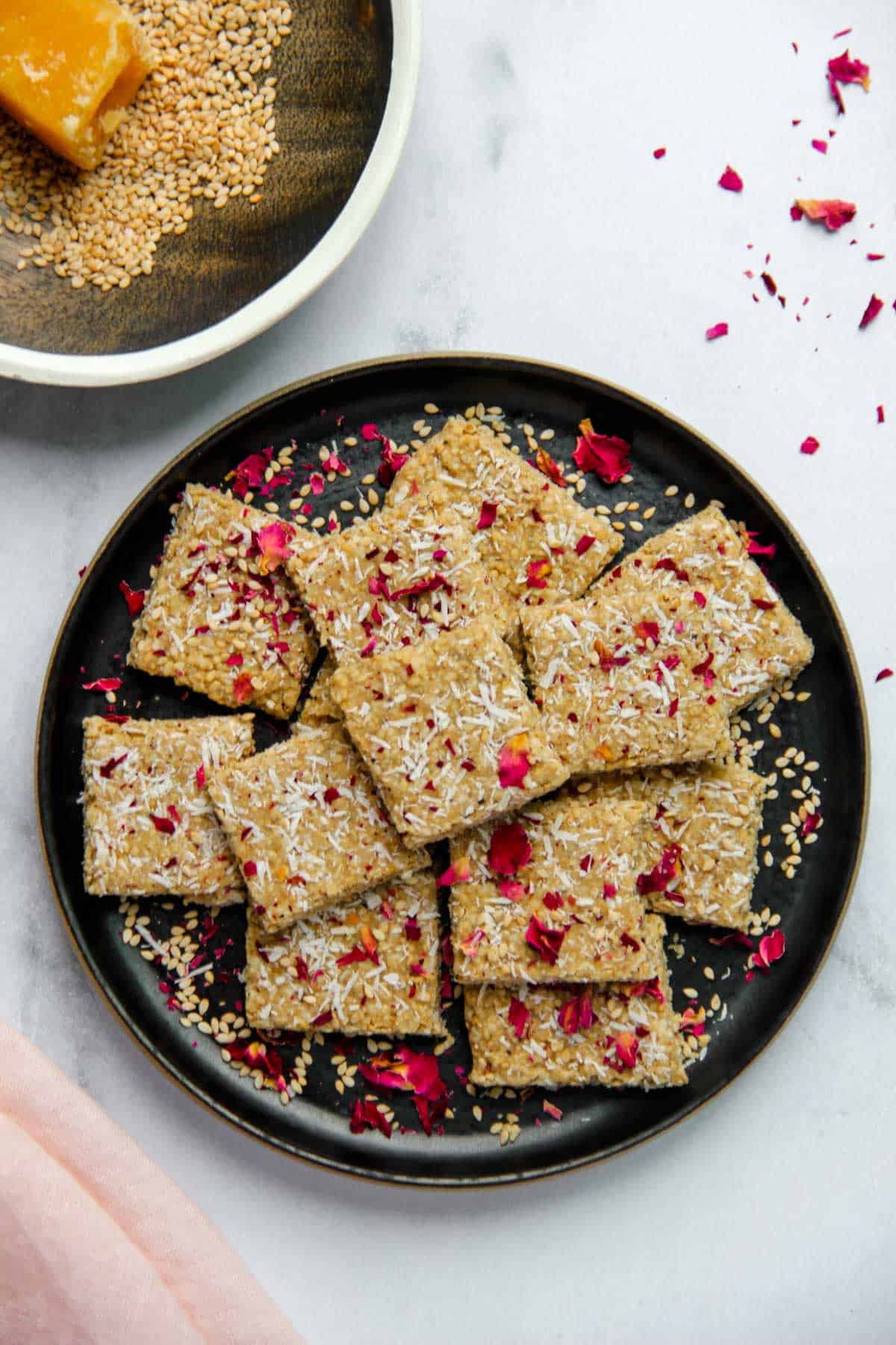 Til vadi garnished with coconut and rose petals