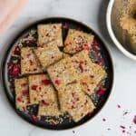 Til vadi garnished with coconut and rose petals