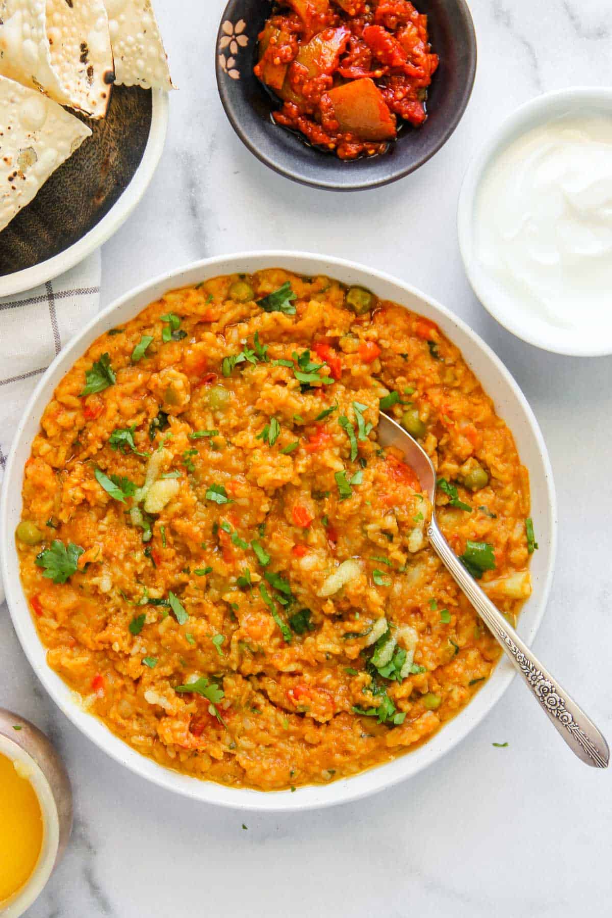 Vegetable Khichdi served in a white bowl  
