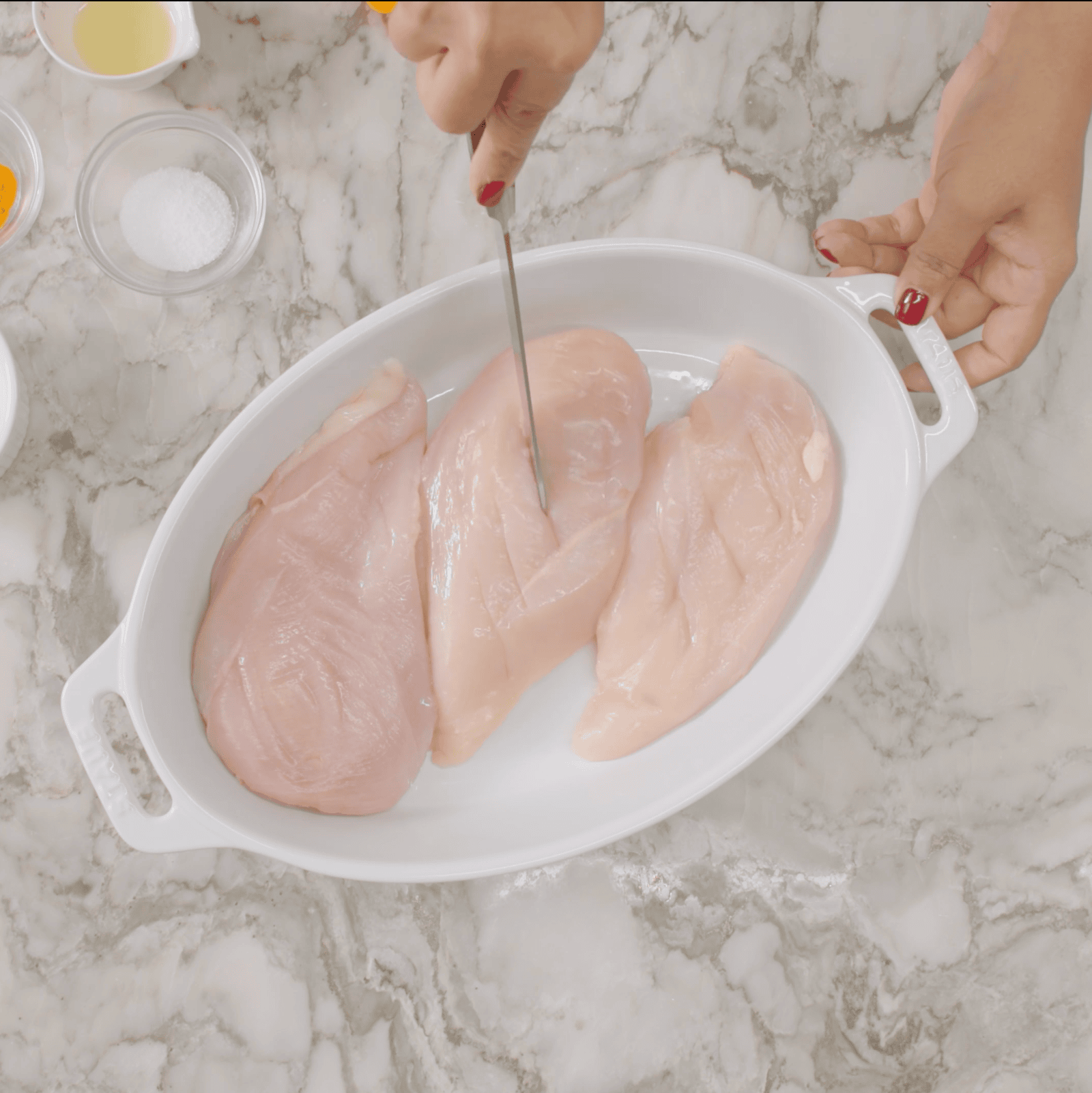 Making slits in chicken breasts
