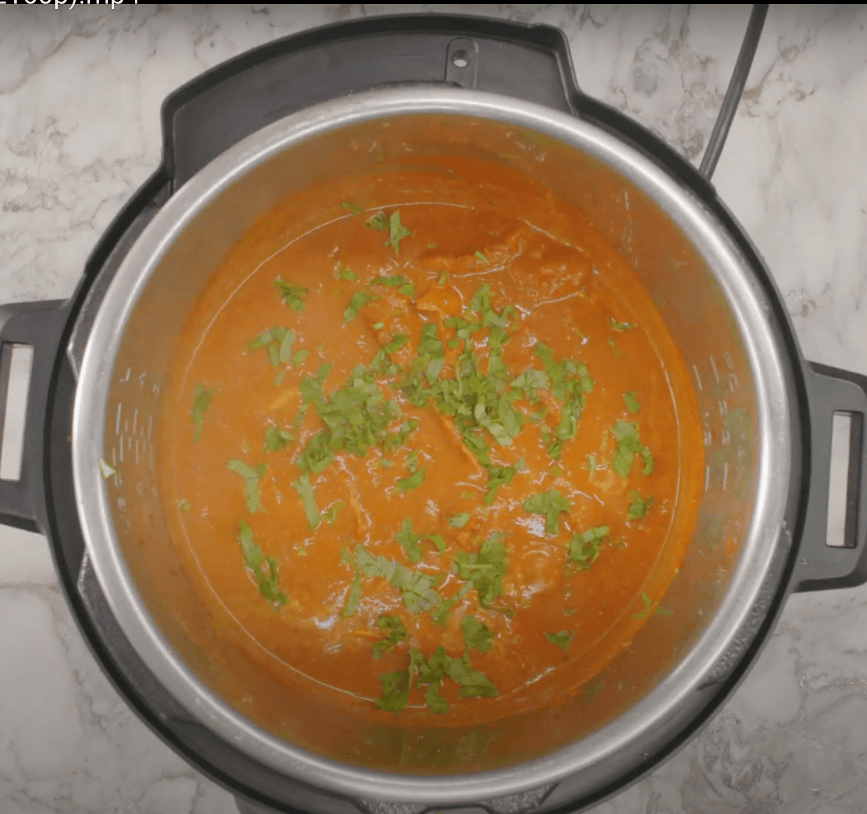 chicken tikka masala garnished with cilantro in the Instant Pot.