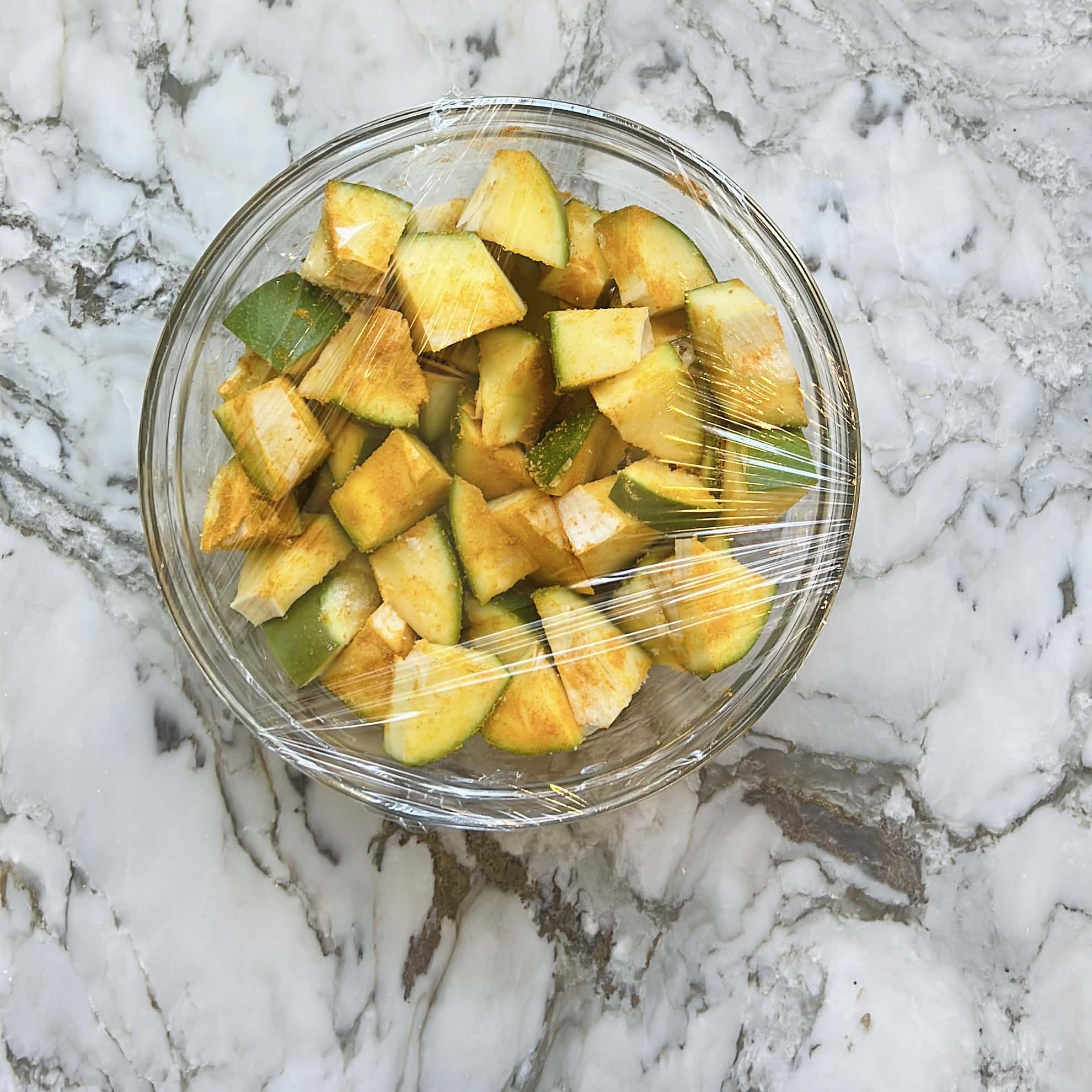 covered bowl with mango pieces