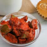 aam ka achar in a glass bowl